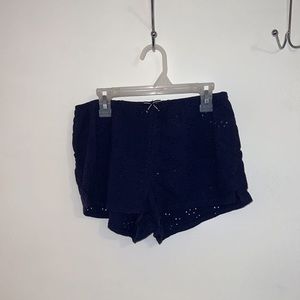 Two pairs of aerie sleep shorts in navy blue and rust orange